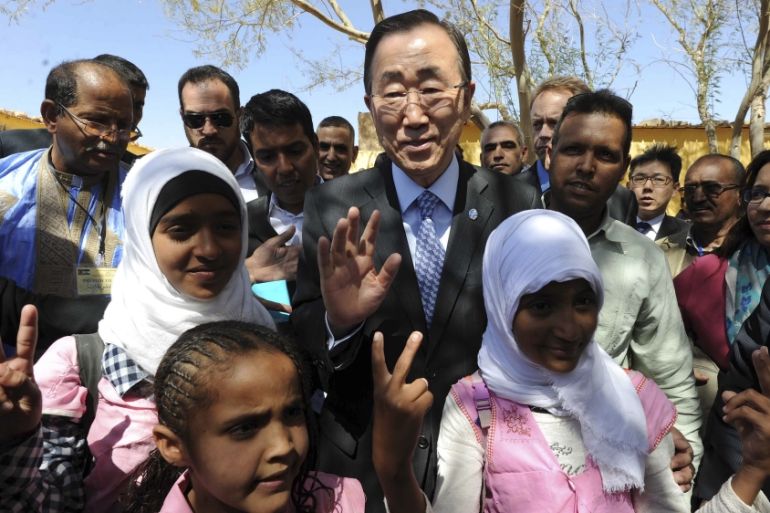 United Nations secretary-general Ban Ki-moon poses with children as he visits the Smara refugees camp