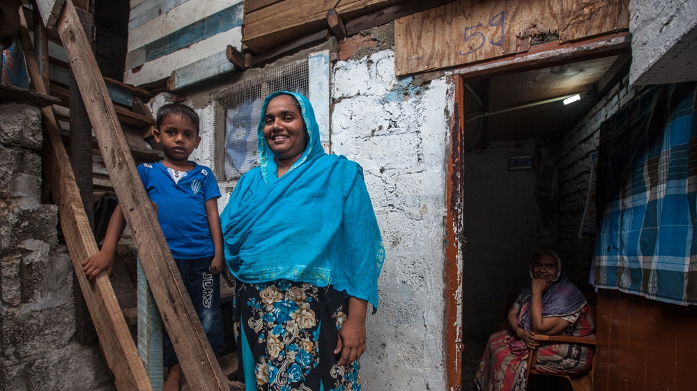 Fathima Rizana says it's thanks to the midwives that her sons Mohammed Rafi, Mohammed Rashi and Mohammed Raheem (pictured with his mother) are all doing well [Suda Shanmugaraja/Al Jazeera] 