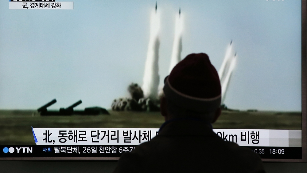 TV screen showing a file footage of the missile launch conducted by North Korea [Lee Jin-man/Associated Press]