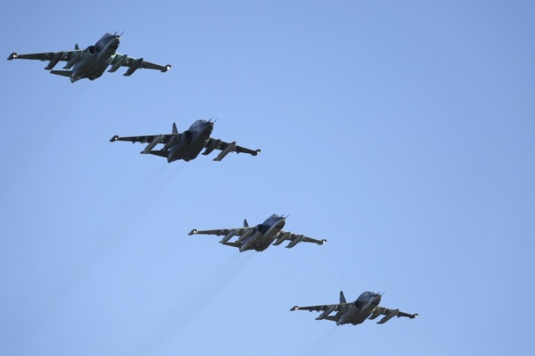 Russian Ministry of Defence handout photo shows Russian Sukhoi Su-25 fighter jets flying in formation after returning from Syria, before landing at an airbase in Krasnodar region, southern Russia