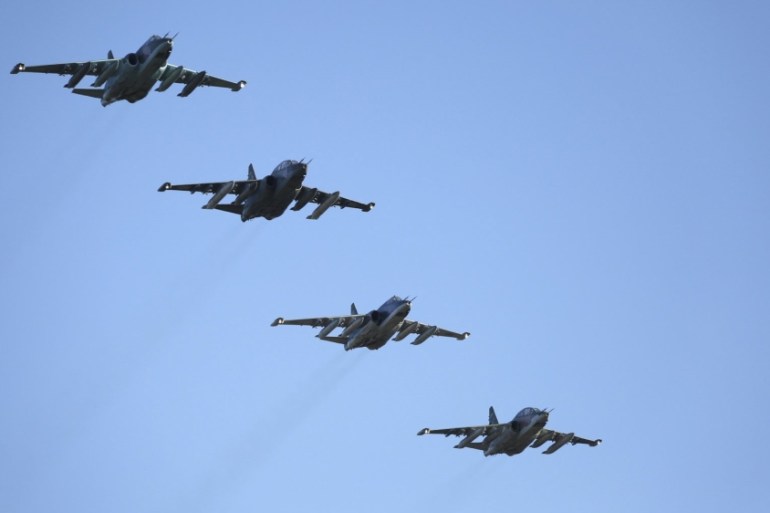 Russian Ministry of Defence handout photo shows Russian Sukhoi Su-25 fighter jets flying in formation after returning from Syria, before landing at an airbase in Krasnodar region, southern Russia