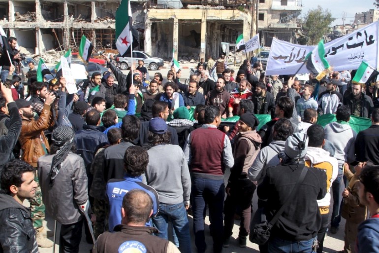 People attend an anti government protest in Bab al-Hadid district of Aleppo