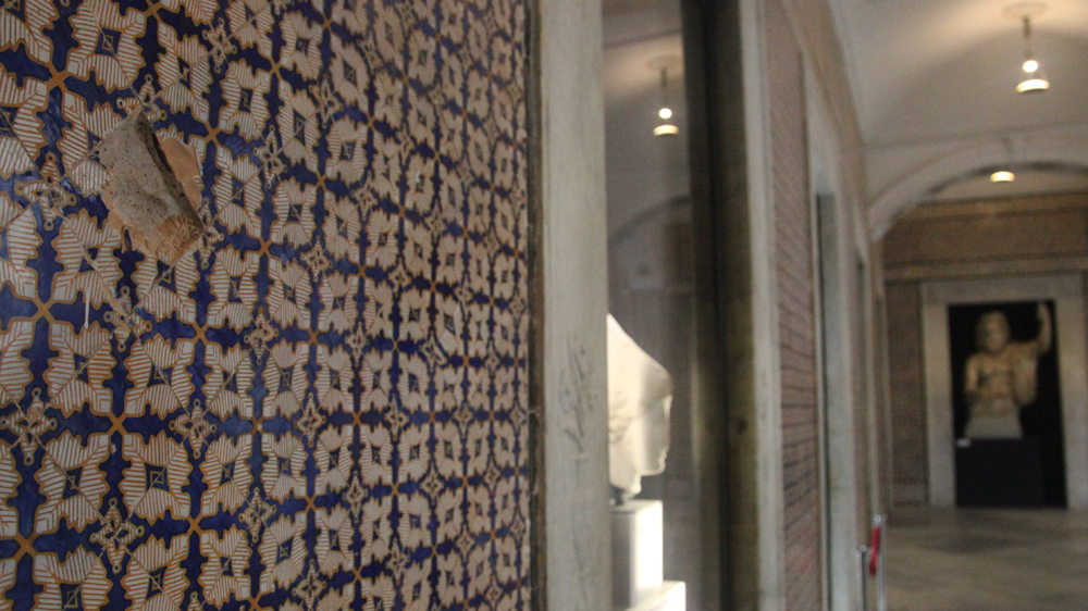 Bullets caused damage to this wall in the Bardo Museum's Carthage Room [Thessa Lageman/Al Jazeera]