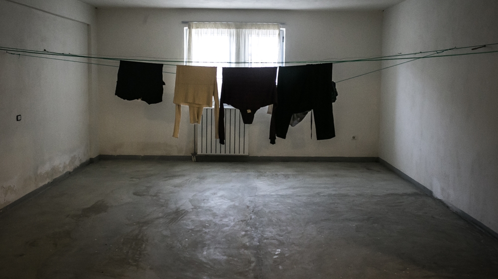 Clothes left to dry in a room at the detention centre in Karrec [Nicola Zolin/Al Jazeera] 