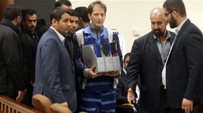 Babak Zanjani (centre) holding documents as he arrives at court in Tehran in November 2015. [EPA]