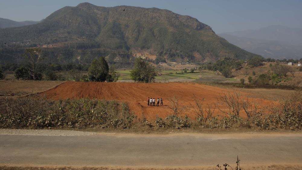 The land selected for the new settlement has good access to healthcare and education, and the risk of landslides is non-existent [Niranjan Shrestha/Al Jazeera]