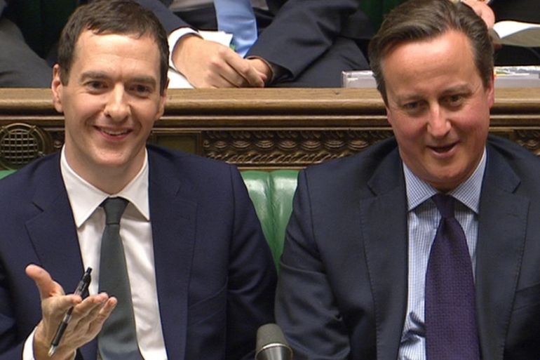 A still image from video shows Britain''s Chancellor of the Exchequer George Osborne seated with PM David Cameron after delivering the Autumn Statement in London