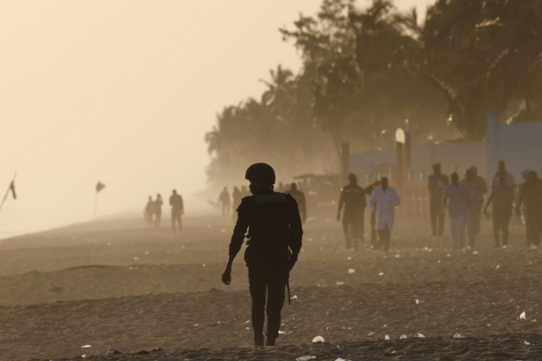A security officer walks on the beach after an attack in Grand Bassam, Ivory Coast [REUTERS]