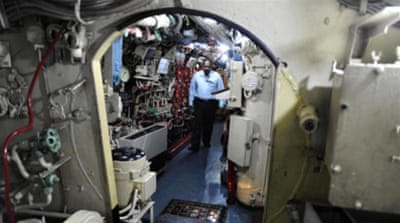 An Indian official walks inside the INS Kursura, on display as a part of the INS Kurusura Submarine Museum, in Visakhapatnam, near Hyderabad [AFP] 