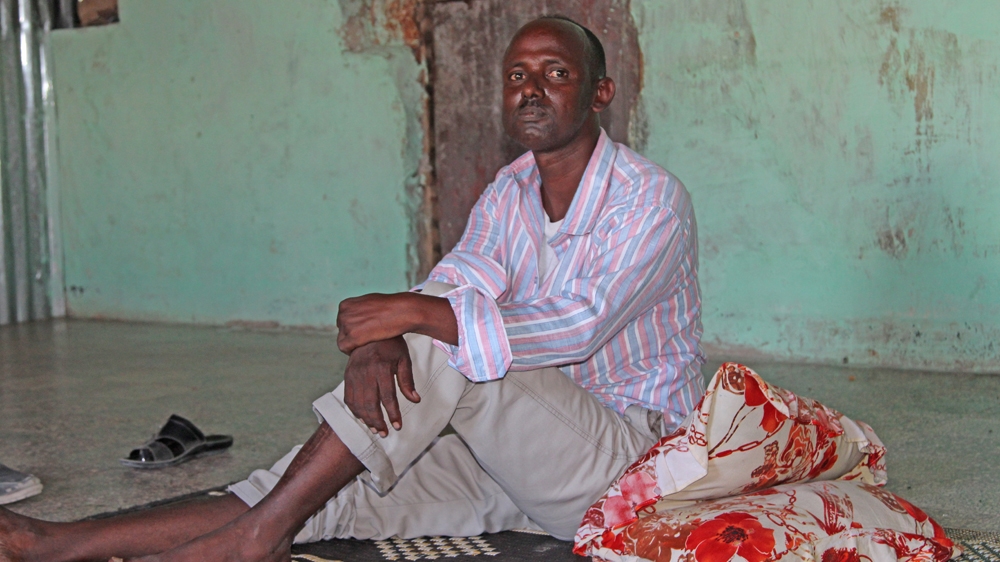 Hasan Mohamed Yusuf, the 37-year-old father of four, says the injuries he sustained to his legs after a roadside bomb are not just physical [Ahmed Farah/Al Jazeera]