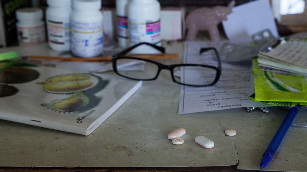 HIV medication is seen on a table inside a house in Cambodia [Omar Havana/Getty Images]
