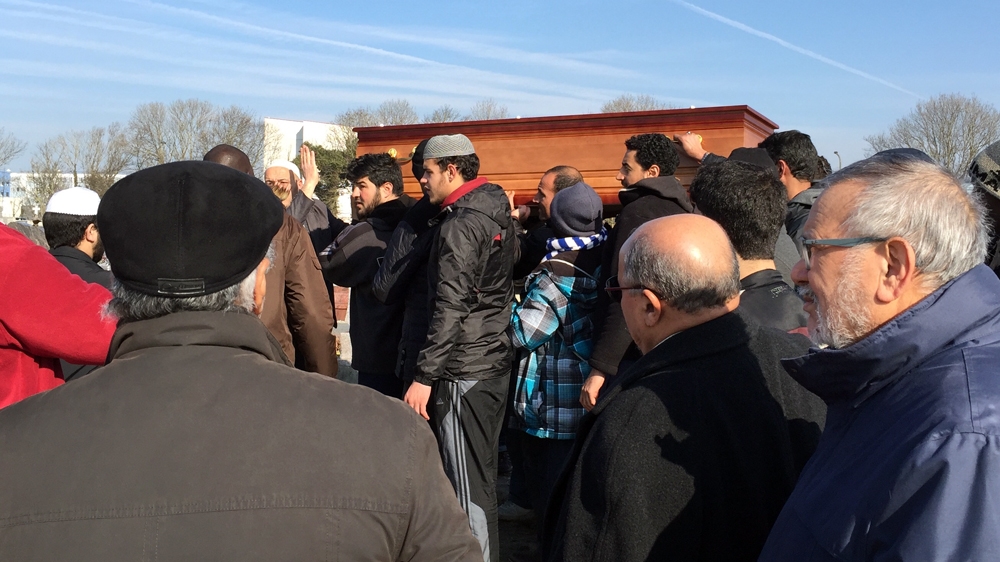 Mourners carry Gomaa Makeen's coffin to his grave [Shafik Mandhai/Al Jazeera]