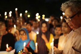 The father of the writer-blogger Avijit Roy attends a candlelight vigil at the spot where his son was killed in Dhaka, Bangladesh [EPA]