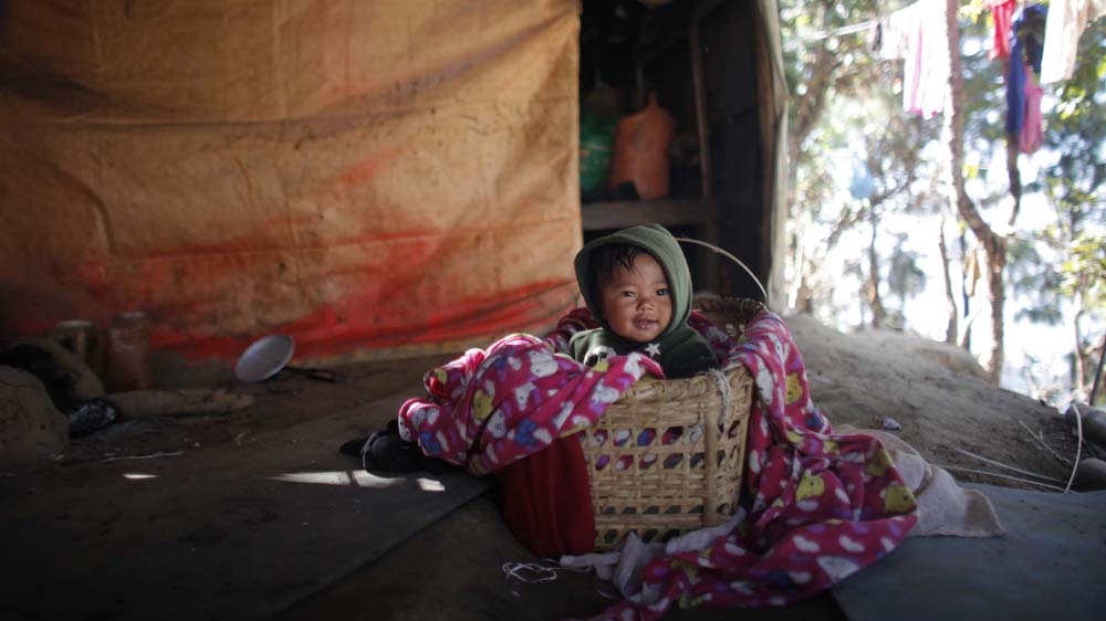 Babies born at the Kalikasthan temporary camp will grow up in surroundings vastly different from their ancestral village of Tiru [Niranjan Shrestha/Al Jazeera]