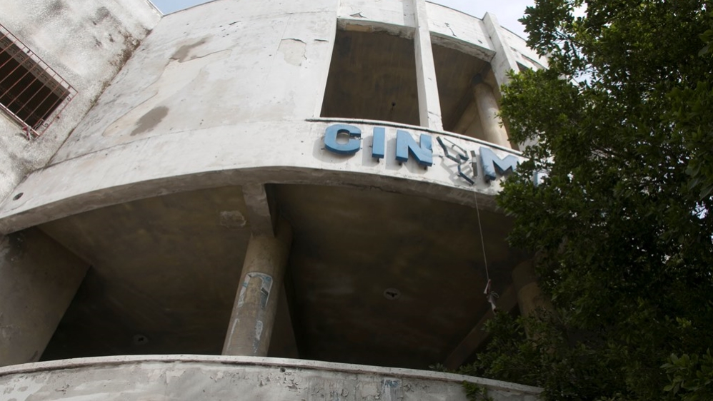 Despite the charred walls and debris strewn throughout Al-Nasser Cinema, it is easy to imagine its former grandeur [Ylenia Gostoli/Al Jazeera]