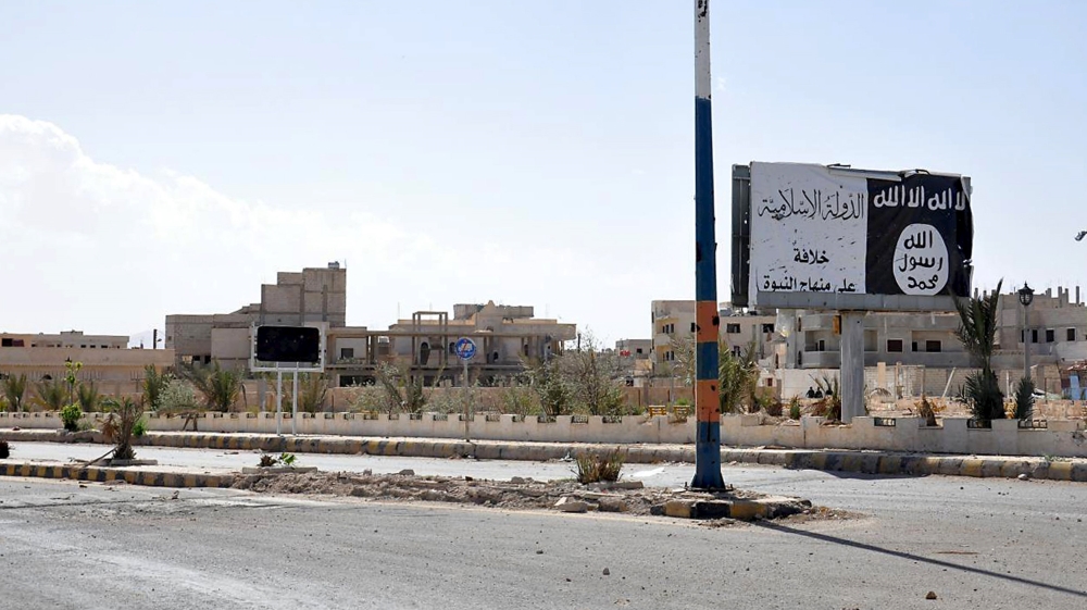 A billboard erected by ISIL during its ten-month rule in Palmyra [Reuters via SANA]