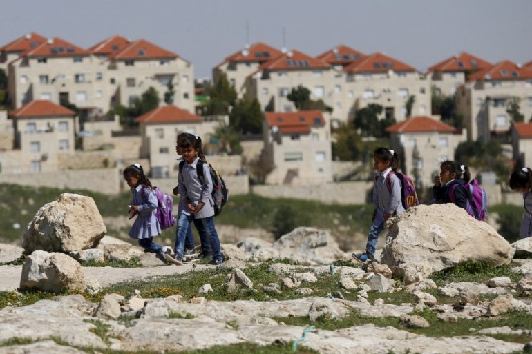 Palestinian bedouin students return from school to their homes near the Jewish settlement of Maale Adumim in the West Bank village of Al-Eizariya