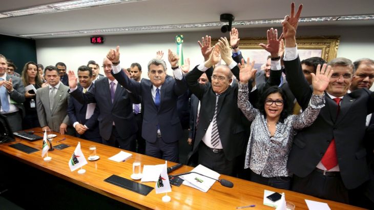 Congressman of the Brazilian Democratic Movement Party (PMDB) celebrate after announcing that they are withdrawing their support of President Dilma Rousseff''s ruling coalition