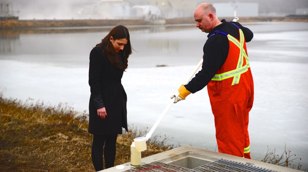 Student Emma Persad gets a water sample from the sewage treatment plant in Kamloops [Jet Belgraver/Al Jazeera]