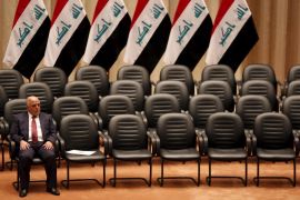 File photo of Iraq''s new premier Haider al-Abadi sitting during a parliamentary session to vote on Iraq''s new government at the parliament headquarters in Baghdad