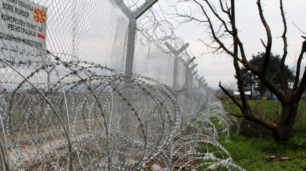The barbed wire border fence, put up by former Yugoslav Macedonian authorities stretches for 20km [John Psaropoulos/Al Jazeera]