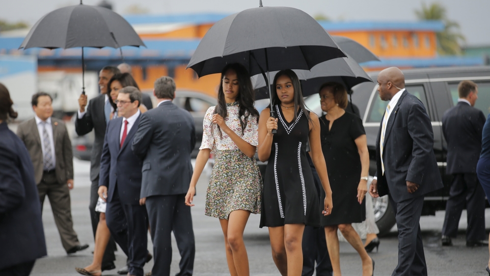 Obama arrived with his wife and two daughters [Carlos Barria/Reuters]