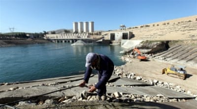 Employees work at strengthening the Mosul Dam in northern Iraq [REUTERS]