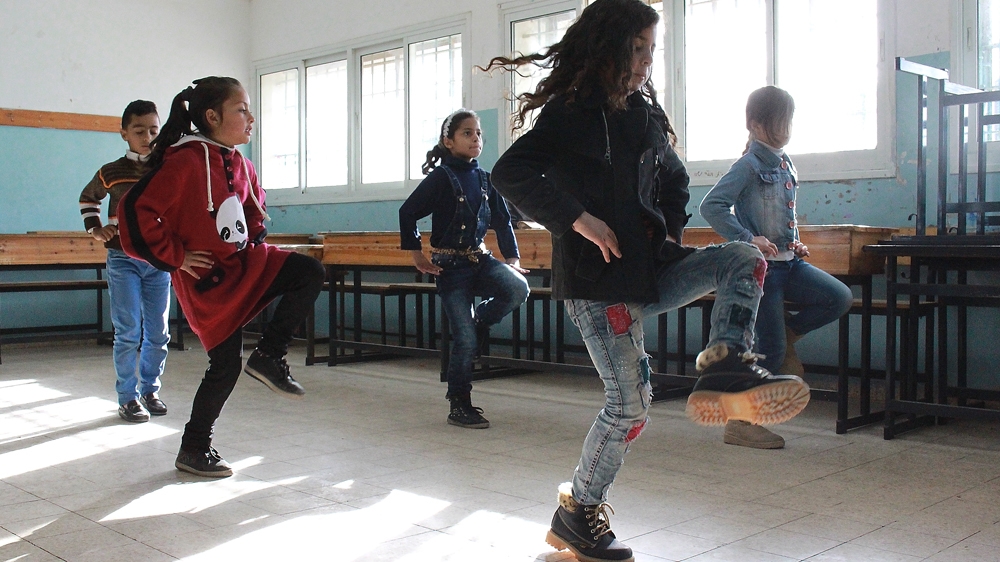 Sounds of Palestine offers a class that teaches Dabka, a lively, traditional Palestinian dance [Julie Ovgaard/Al Jazeera]
