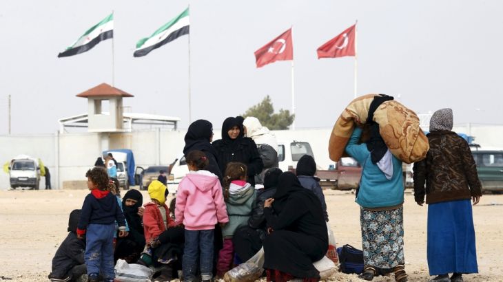 File photo of internally displaced Syrians waiting near the Bab al-Salam crossing, opposite Turkey''s Kilis province