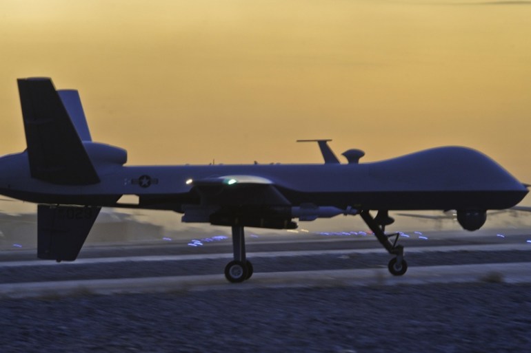 A MQ-9 Reaper drone taxis at Kandahar Airfield, Afghanistan