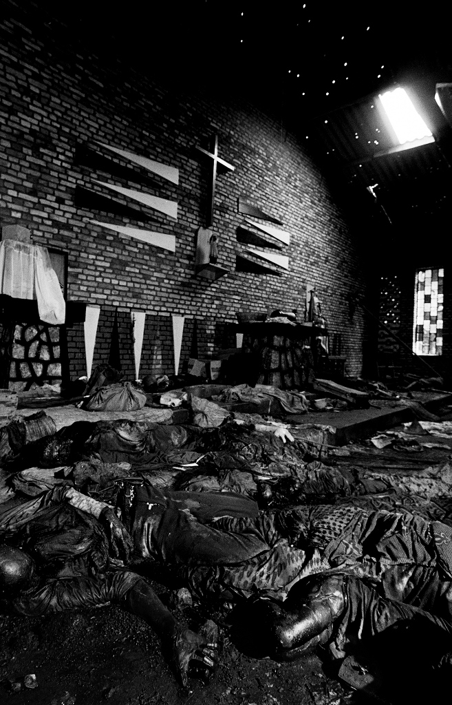The bloated corpses of those killed in the church at Rukara. Hand grenades were first thrown into the church to kill, maim and stun. Then those inside were strafed with machine gun fire [Jack Picone/Al Jazeera]