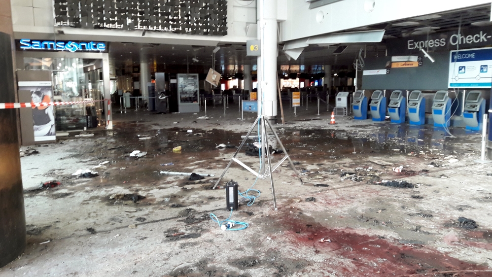 Damage is seen inside the departure terminal following the March 22, 2016 bombing at the airport [AP]