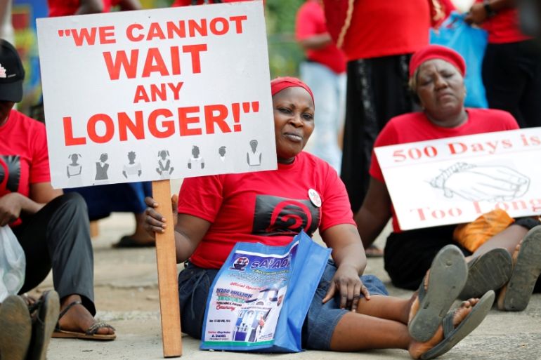 Women carrying placards attend a street protest campaigning for the rescue of abducted Chibok girls, in the Ikeja district of Lagos