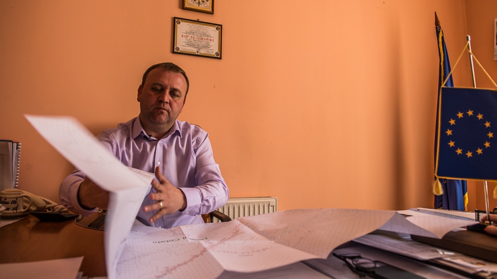 Oprea Lucian Vasile, the mayor of Holbav, says he has not received any money from the central government to expand the electricity grid in his village [Felix Gaedtke/Al Jazeera] 