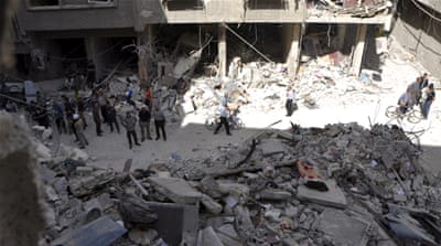 A site hit by what activists said were barrel bombs thrown by forces loyal to Assad, in the Palestinian Yarmouk refugee camp on the southern outskirts of Damascus [Reuters]