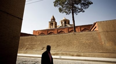 An Iranian Armenian man walks past Saint Nerses church at the Julfa neighbourhood in the historic city of Isfahan [AFP]