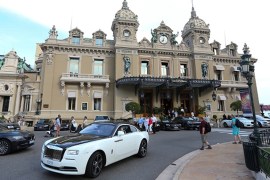 A Rolls-Royce drives in front of the Casino de Monte-Carlo in Monaco [Getty]
