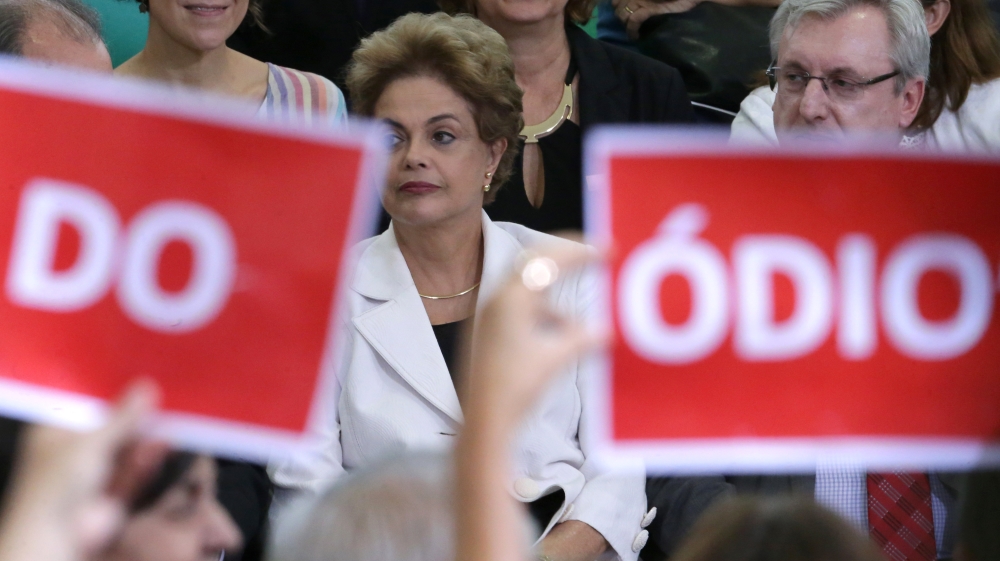 Rousseff is accused of trying to cover up government shortfalls during her 2014 re-election [Eraldo Peres/AP]