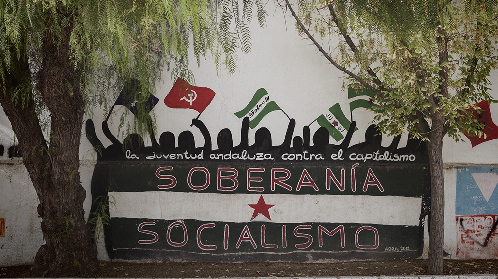 The message on the wall in Marinaleda reads: 'Sovereignty and socialism' [Hagar Jobse/Al Jazeera]