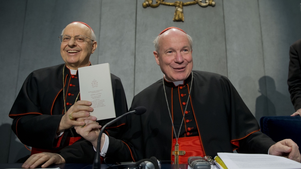 The document was presented to the press by Cardinals Lorenzo Baldisseri, left, and Christoph Schoenborn on Friday [The Associated Press]