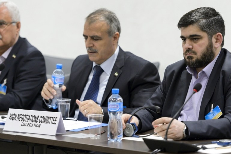 Members of the Syrian opposition delegation of the HNC attend a meeting in Geneva