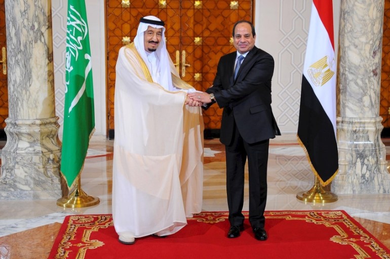 Egyptian President Abdel Fattah al-Sisi and King Salman of Saudi Arabia shaking hands during the reception ceremony in the Egyptian Presidential Palace in Cairo