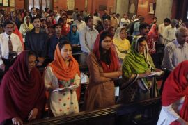 Pakistani Christians attend services for the victims of suicide bombing
