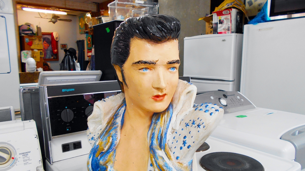 An Elvis Presley statue can be seen in the store [Andreanne Williams/Al Jazeera] 