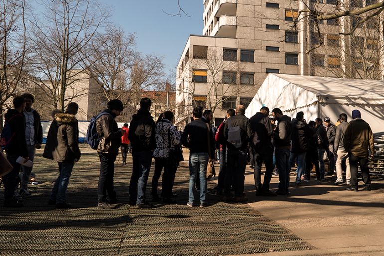 Refugees at State Office for Health and Social Affairs in Berlin [ Sorin Furcoi/Al Jazeera]