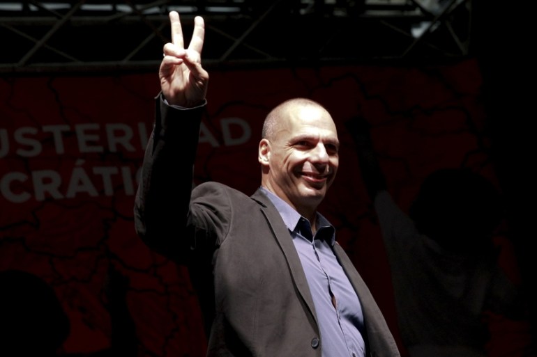 Former Greek Fnance Minister Varoufakis gestures as he arrives to take part in the "Plan B against austerity and for a democratic Europe" conference in Madrid