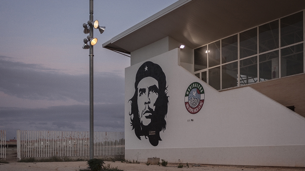 Marinaleda's sports centre with its picture of Che Guevara [Hagar Jobse/Al Jazeera] 