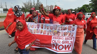 People participate in a march that is part of the 'Bring Back Our Girls' campaign, in memory of the Nigerian girls abducted by Boko Haram. [AP]