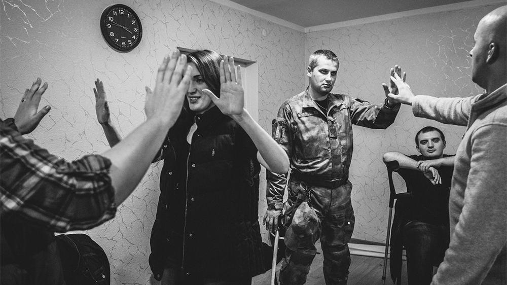 
Volunteers Marina and Darina participate in a PTSD seminar organised by Wounded Warrior Ukraine [Ioana Moldovan/Al Jazeera]
