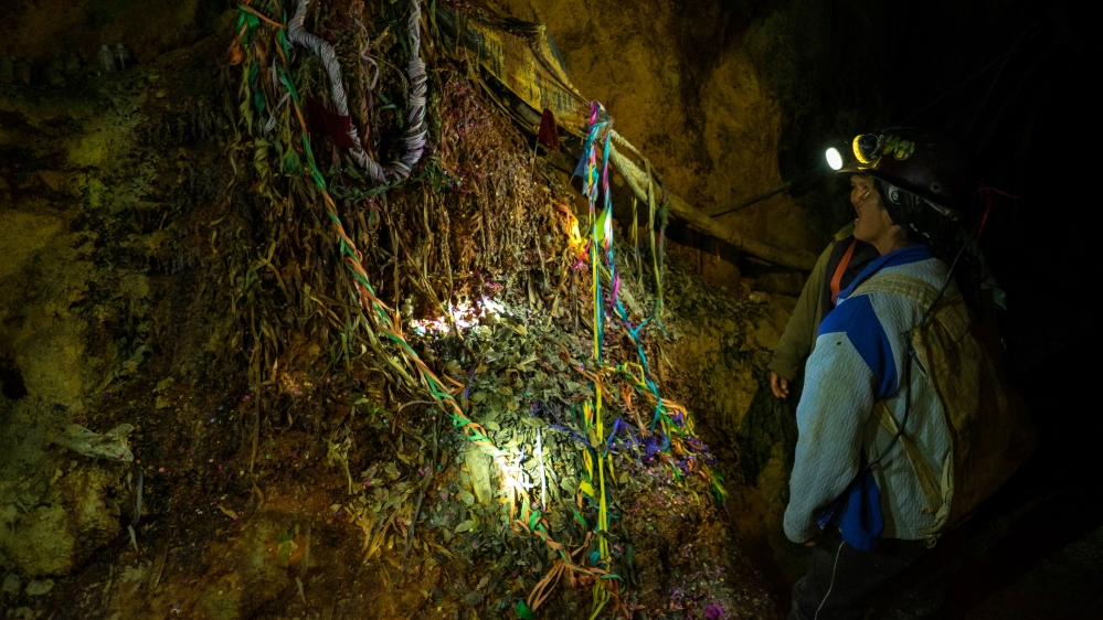 El Tio, covered in dripping minerals, where the miners offer alcohol and coca leaves in exchange for the protection from the deity [Eline van Nes/Al Jazeera]